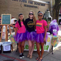 <p>Katie Smercak (middle) with her friends at the Lemonade for Leukemia &quot;Pop-Up Shop&quot; at Tarrytown&#x27;s Third Friday. They are each wearing a tshirt design from three different years.</p>