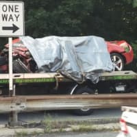 <p>The vehicle involved in the fatal crash is placed on a tow truck Wednesday morning. </p>