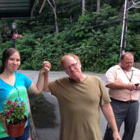 <p>Avi Schwartz, center, and Principal Paul Tobin, right, at the recent planting at the Station Cafe in Hastings.</p>