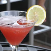<p>Dolphin&#x27;s Charlie Parker Punch is made with SKYY grape vodka, pineapple juice and cherry juice, shaken and served in a highball glass garnished with a lemon wheel.
</p>