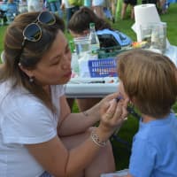 <p>Face painting was one of the activities offered at the Chappaqua summer concert.</p>