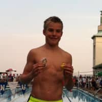 <p>Ryan Maierle displays his first-place medals at the Westchester Swimming Championships on Thursday, July 31.</p>