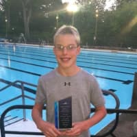 <p>Ryan Maierle holds his High Point Award at the Westchester Swimming Championships on Thursday, July 31.</p>