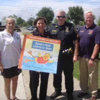 <p>Pam Raila of the Norwalk Parks and Recreation Department, Deputy Police Chief Susan Zecca, Sgt. Terry Blake, Mark Blake of Safe Kids Connecticut and Doreen Miner of Stew Leonard III Children&#x27;s Charities at Calf Pasture Beach.</p>