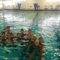 <p>The Marlins swimmers after a workout will compete in Indianapolis this week at a Junior National meet.</p>