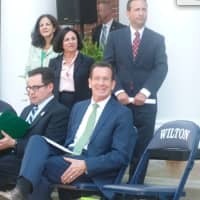 <p>A smiling Gov. Dannel P. Malloy, is with DEEP Commissioner Robert Klee, sitting at left. In back from left are state Rep. Gail Lavielle, R-143rd District, and state Sens. Toni Boucher, R-26th District, and Bob Duff D-25th District.</p>