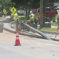 <p>Workers put in the 8-inch polyethylene pipe in front of the Village Market on Old Ridgefield Road in Wilton. Work began Friday and is expected to be completed by the end of November.</p>