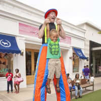 <p>A stilt walker entertained families at Cross County Shopping Centers SummerFest celebration.
</p>