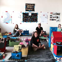 <p>Hommocks students Jonas Varela (left), Christina McGuiness (center) and Vicky McEvoy (right), create an exhibit which allows visitors to walk among their pieces as if it was a 3D map. </p>