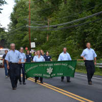 <p>Lewisboro Volunteer Ambulance Corps members march in the South Salem parade.</p>