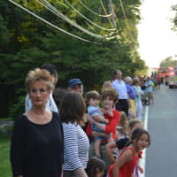 <p>Spectators line the road at the South Salem parade.</p>