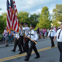 <p>A color guard leads marchers in the South Salem Fire Department  parade.</p>