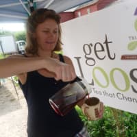 <p>Lisa Feistel, of Westport, owner of Triangle Tea, pours some tea while at the Wilton Farmers Market.</p>