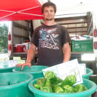 <p>Dominic Gazy of Oxford&#x27;s Gazy Brothers Farm, with some of the farm&#x27;s produce at the Wilton Farmers Market.</p>