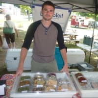 <p>Mike Guthman, of Norwalk, at the Du Soleil tent at the Wilton Farmers Market.</p>