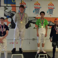 <p>Liam Smith of Wilton takes silver and accepts medals with the others in the Nutmeg Games 2014 Junior U20 Fencing category. </p>