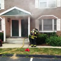 <p>Smoke was seen coming out of the rear of the Fairfield apartment building.</p>