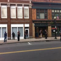 <p>Men are in handcuffs near  Famous Pizza in South Norwalk after a shooting was reported Wednesday afternoon.</p>