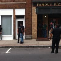 <p>Men are in handcuffs near  Famous Pizza in South Norwalk after a shooting was reported Wednesday afternoon.</p>