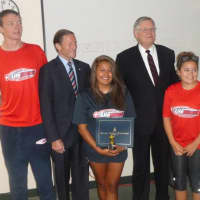 <p>Brenda Moratoya, center, of Stamford is honored Wednesday for saving the life of a teenager in a near drowning on Aug. 6. From left is lifeguard Richard Glass, U.S. Sen. Richard Blumenthal, Mayor David Martin and lifeguard Leann Moy.</p>