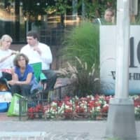 <p>Some of the Beach Boy fans sitting on the other side of the Washington Boulevard on Thursday evening.</p>