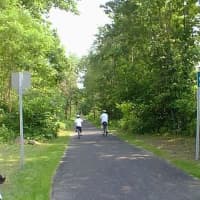 <p>Bicyclists on the South County Trailway.</p>