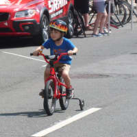 <p>A young racer  at the Danbury Audi Race4Scholars Criterium amateur and professional races. It was held on a 1-kilometer course in the city.</p>