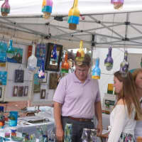 <p>People in the crowd at the SoNo Arts Celebration on Sunday check out one of the vendor displays. </p>