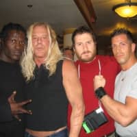 <p>Giovanni Roselli (right) poses with WWE wrestler &quot;R-Truth&quot; (left) and &quot;The Wrestler&quot; star Mickey Rourke (second from left).</p>