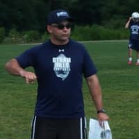 <p>Byram Hills football coach Scott Saunders gives instructions during the opening day of summer practice Monday, Aug. 18. </p>
