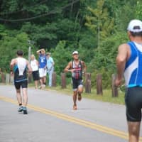 <p>Easton&#x27;s Chris Thomas heads for first place among amateur athletes in Sunday&#x27;s 70.3 mile Ironman race in New Hampshire. </p>