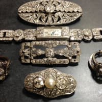 <p>Assorted art deco &amp; platinum brooches, watch and rings</p>