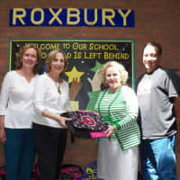 <p>Roxbury Elementary: Principal Connie Stevenson and Assistant Principal Kenneth Childs also receive backpacks for children at their school.</p>