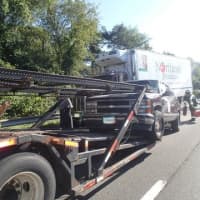 <p>A Chevy Suburban was rear-ended and smashed into a car carrier on I-95 in Westport on Tuesday morning. </p>