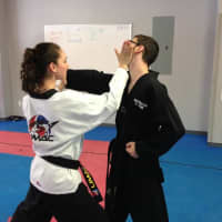 <p>UMAC Ardsley instructors show a Taekwondo skill.</p>