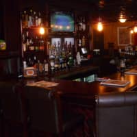 <p>A view of the bar area at Center Street Public House in Darien.</p>