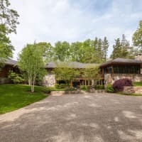 <p>The home at 8 Circle Road in Darien is close to town but has a secluded feel.</p>