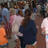 <p>Tucker Murphy, executive director of the New Canaan Chamber of Commerce, during the Taste of the Town Stroll on Thursday evening. </p>