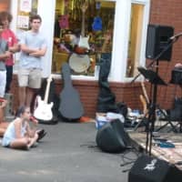 <p>Music lovers listening during a group&#x27;s performance at the Taste of the Town Stroll Thursday in New Canaan.</p>