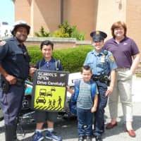 <p>Police Officer Kenny Hudson and Detective Lillian Sanchez along with students Eddie Hayes, left, Armando Sanchez and AAA spokeswoman Barbara Ward.</p>