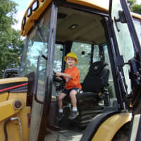 <p>An Eastchester youngster enjoying the trucks at a past Touch-A-Truck event.</p>