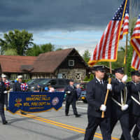 <p>Mahopac Falls firefighters march in the Mahopac Volunteer Fire Department&#x27;s 100th Anniversary Dress Parade.</p>