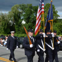 <p>Firefighters march in the Mahopac Volunteer Fire Department&#x27;s 100th Anniversary Dress Parade.</p>