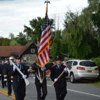 <p>Firefighters march in the Mahopac parade.</p>