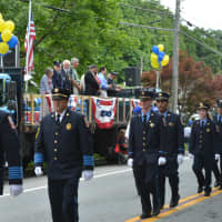 <p>Putnam Lake firefighters march in the Mahopac parade.</p>