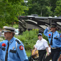 <p>Mill Plain (Danbury) firefighters give salutes at the Mahopac parade.</p>