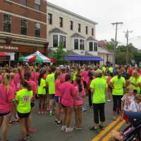 <p>Runners mingle near the starting line prior to Friday&#x27;s All Out For Autism 5k race in New Canaan.</p>