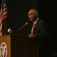 <p>Superintendent Manuel Rivera addresses an enthusiastic crowd of teachers and faculty members at the annual convocation.</p>