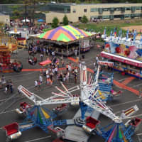 <p>Kids enjoy rides at last year&#x27;s carnival.</p>