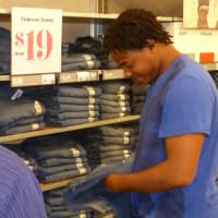 <p>A Regeneron employee helps Jessie Clarke pick out a good fit and good deal. </p>